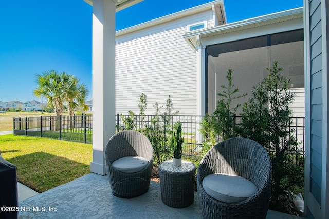 view of patio featuring fence