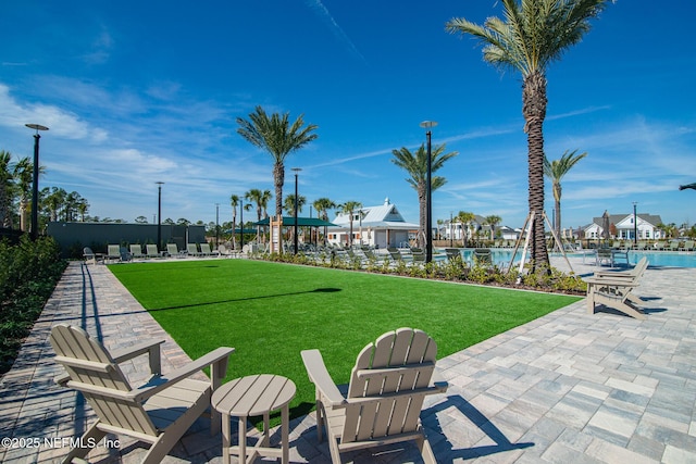 exterior space featuring a patio area and a community pool