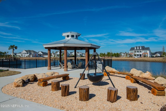 view of jungle gym with a gazebo, a residential view, and fence