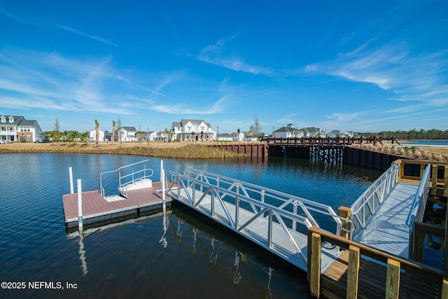 dock area featuring a water view and a residential view