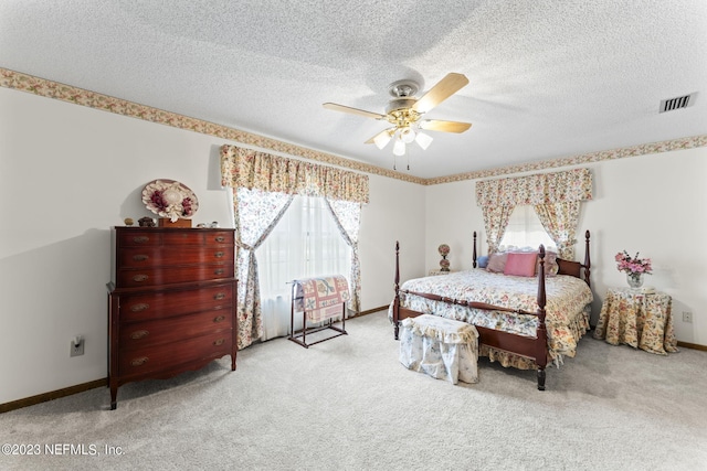 bedroom with multiple windows, carpet, visible vents, and baseboards