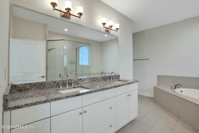 bathroom with a shower stall, a bath, double vanity, and a sink