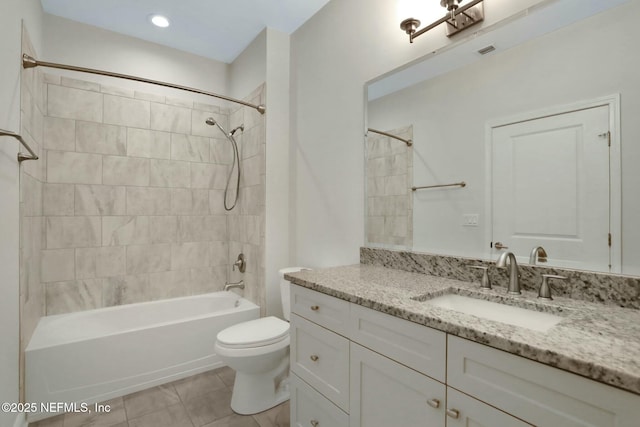 bathroom featuring visible vents, tub / shower combination, toilet, tile patterned floors, and vanity