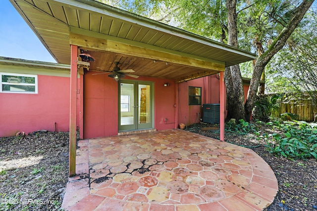 view of patio featuring central air condition unit, french doors, ceiling fan, and fence