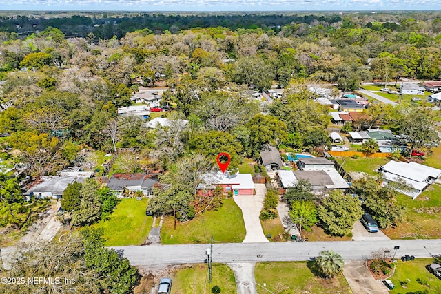 aerial view featuring a residential view and a view of trees