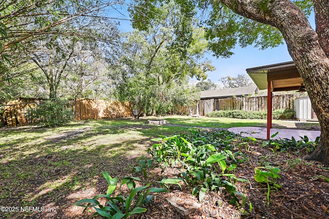 view of yard featuring a patio area and fence