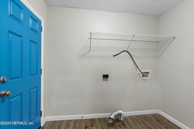 laundry room featuring dark wood finished floors, laundry area, baseboards, and washer hookup