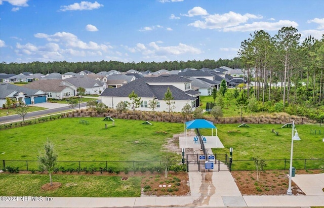 birds eye view of property with a residential view