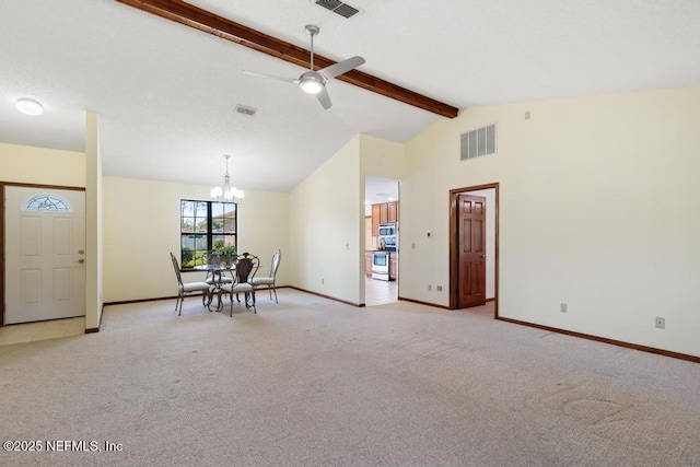 interior space with beamed ceiling, light colored carpet, baseboards, and visible vents