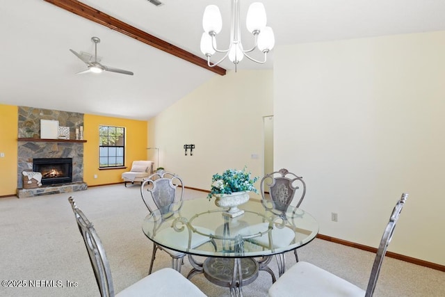 dining area with carpet, vaulted ceiling with beams, a fireplace, and baseboards