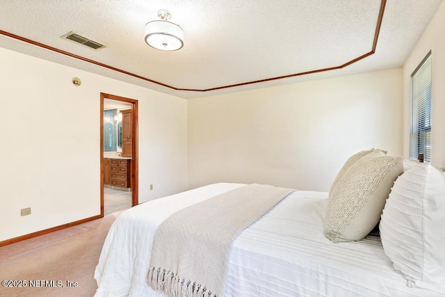 bedroom with visible vents, a textured ceiling, connected bathroom, baseboards, and light colored carpet