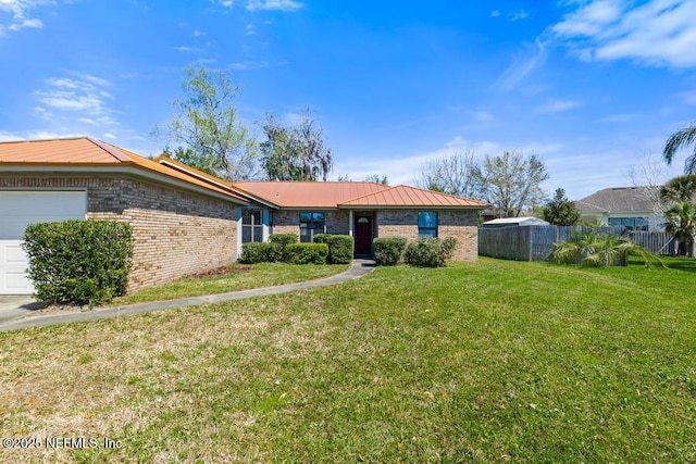 ranch-style house featuring brick siding, a front lawn, fence, metal roof, and a garage