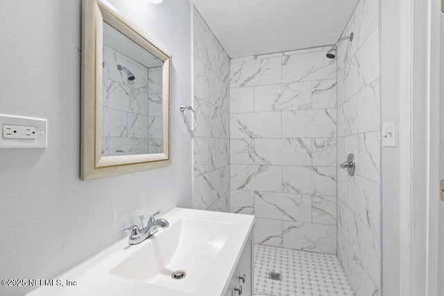 bathroom featuring a shower stall and vanity