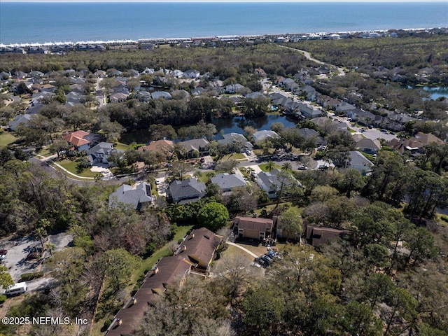 bird's eye view featuring a water view and a residential view