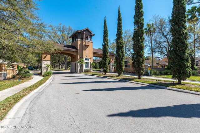 view of street featuring curbs and sidewalks