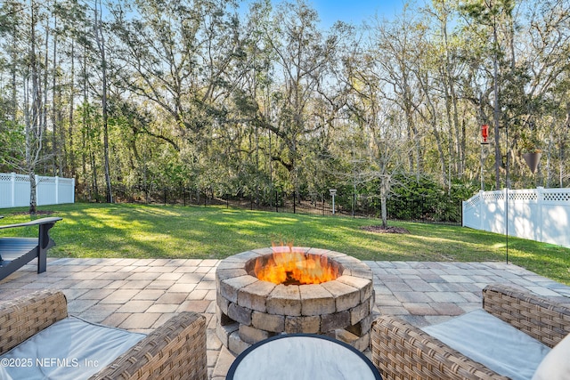 view of patio / terrace with a fire pit and a fenced backyard