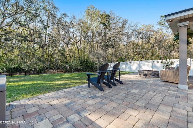 view of patio / terrace featuring a fenced backyard and an outdoor fire pit