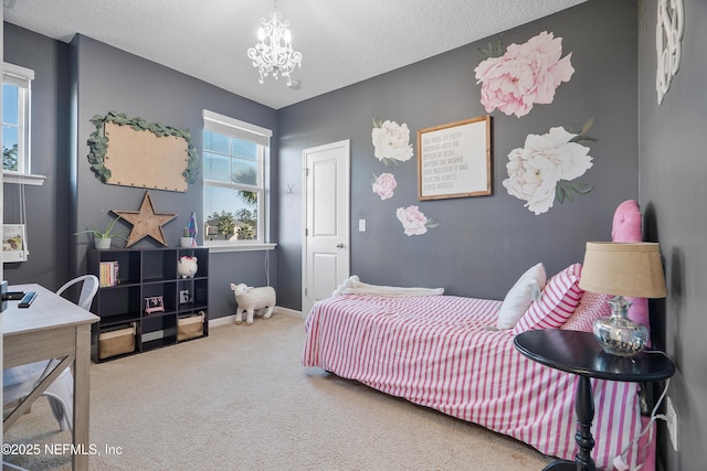 bedroom featuring a notable chandelier, baseboards, carpet floors, and a textured ceiling