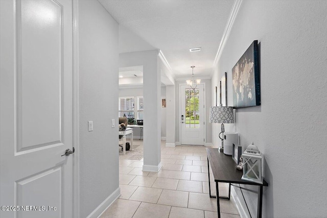 116 Clarendon Rd, Saint Johns, FL 32259 - hall with light tile patterned floors, ornamental molding, baseboards, a chandelier, and visible vents