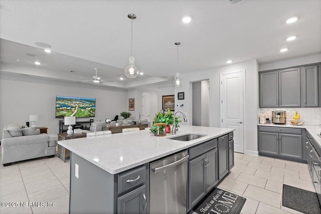 116 Clarendon Rd, Saint Johns, FL 32259 - kitchen featuring a tray ceiling, recessed lighting, gray cabinetry, a sink, and dishwasher