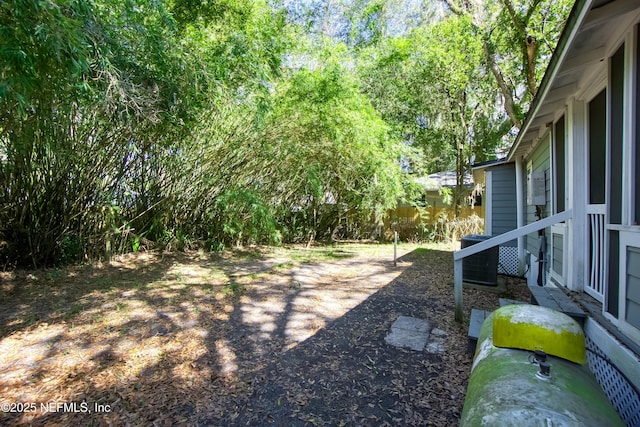 view of yard with central AC unit