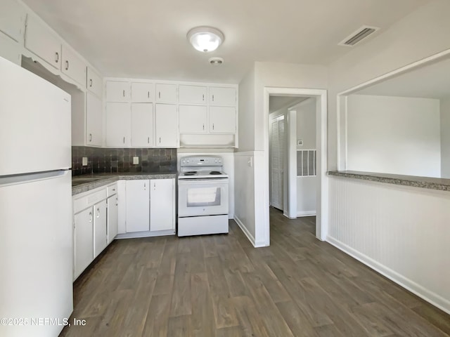 kitchen with under cabinet range hood, visible vents, white cabinets, and white appliances