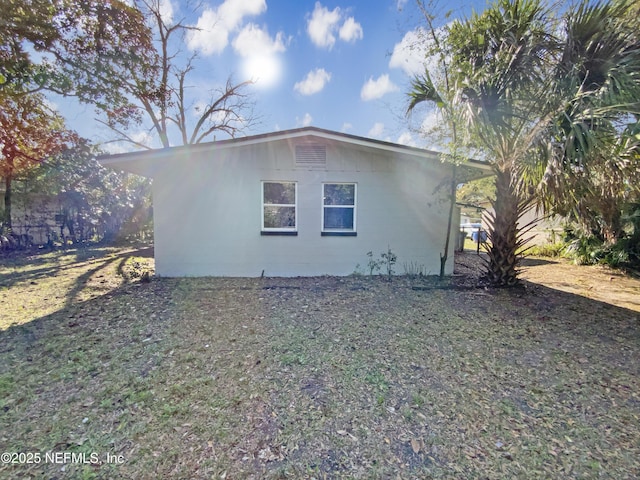 view of side of property featuring concrete block siding