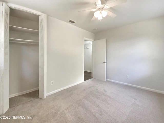 unfurnished bedroom with a closet, visible vents, baseboards, and carpet floors