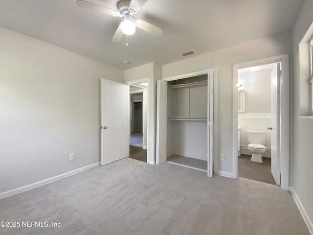 unfurnished bedroom with baseboards, visible vents, carpet floors, and a closet