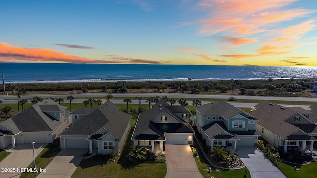 bird's eye view featuring a residential view and a water view