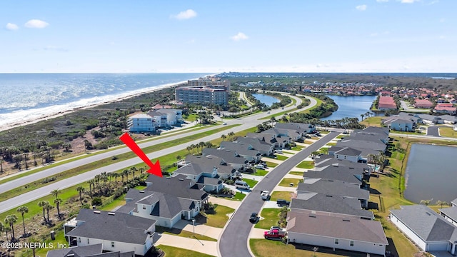 aerial view with a residential view and a water view