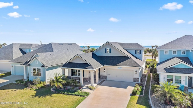 view of front of property with a garage, stone siding, a front lawn, and driveway