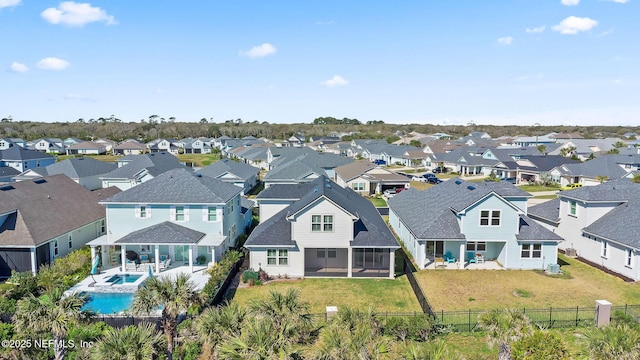 birds eye view of property with a residential view