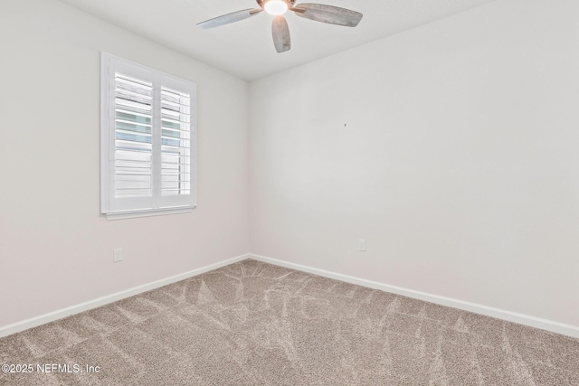 unfurnished room with baseboards, carpet, and a ceiling fan