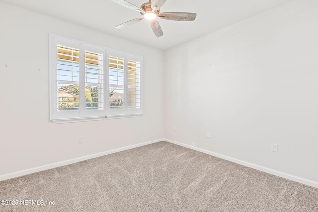 unfurnished room featuring carpet, baseboards, and ceiling fan