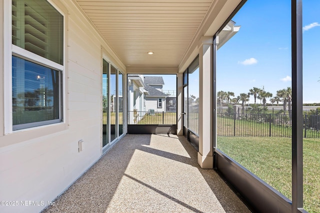 sunroom featuring wood ceiling