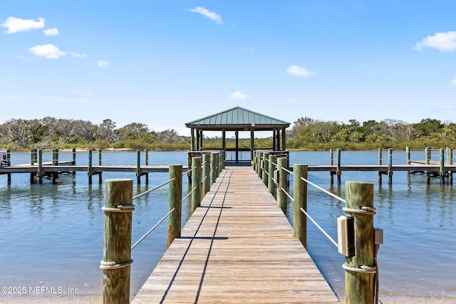 dock area with a gazebo and a water view