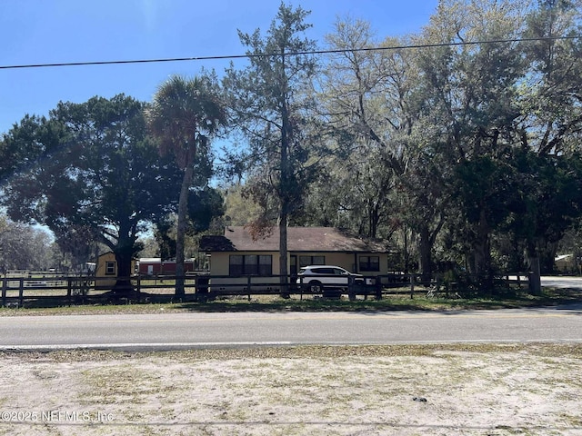 view of front of property with a fenced front yard