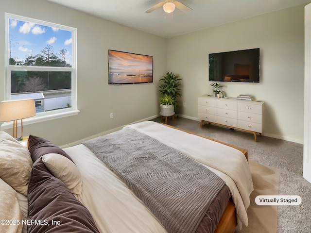 bedroom with a ceiling fan and baseboards