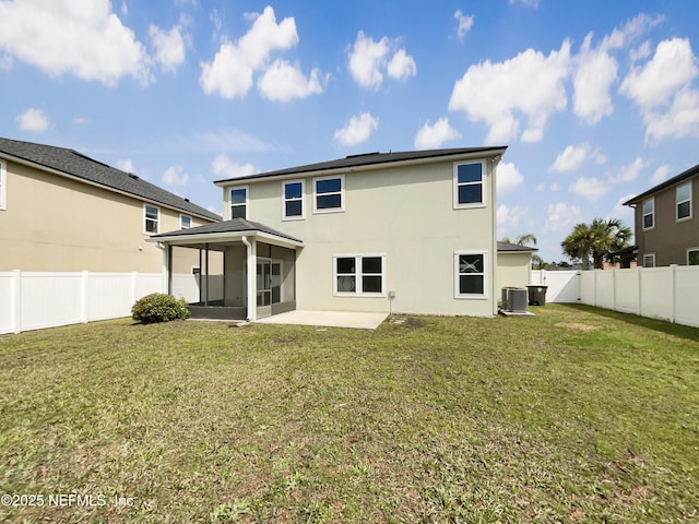 back of property with central AC unit, a lawn, a fenced backyard, and a sunroom