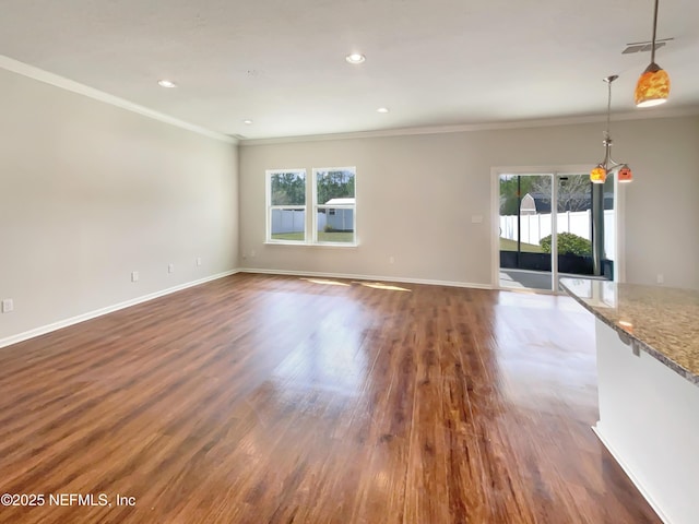 unfurnished living room with visible vents, ornamental molding, dark wood-style floors, recessed lighting, and baseboards