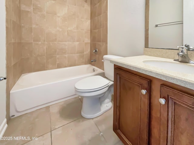 bathroom featuring tile patterned flooring, toilet, vanity, and bathtub / shower combination