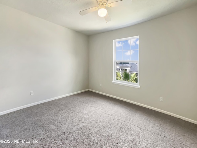 unfurnished room featuring carpet flooring, ceiling fan, and baseboards