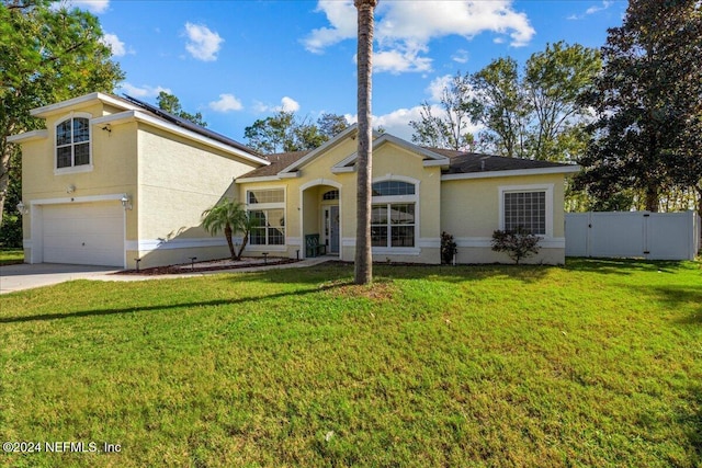 view of front of property with fence, a front lawn, and a gate