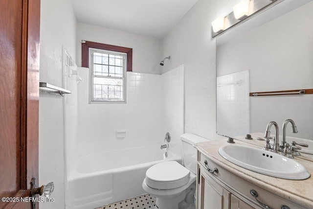 bathroom with vanity, toilet, and shower / washtub combination