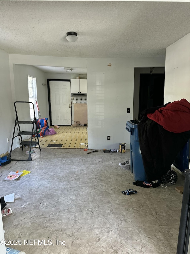 interior space with a textured ceiling