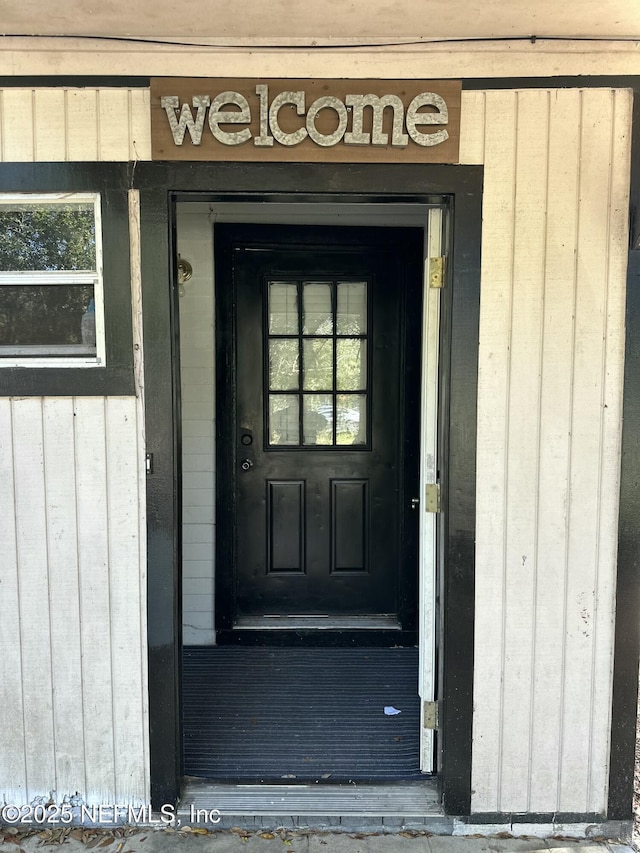 property entrance with board and batten siding