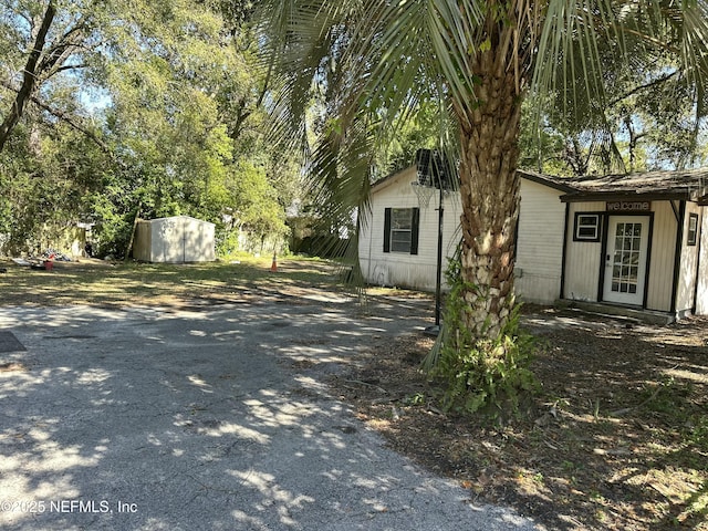 view of side of home featuring an outdoor structure