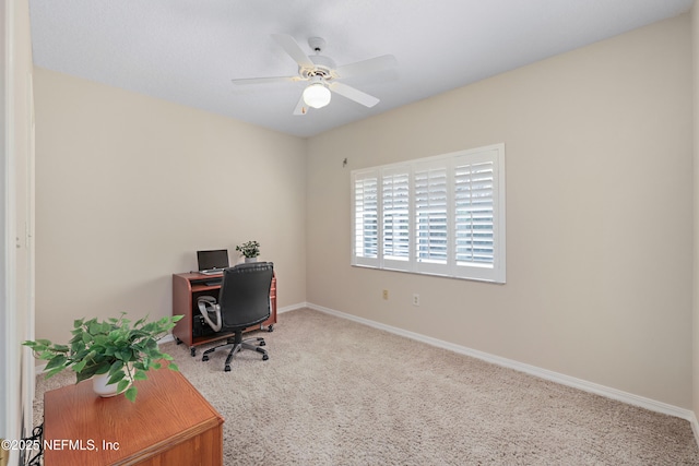 office with baseboards, ceiling fan, and carpet floors