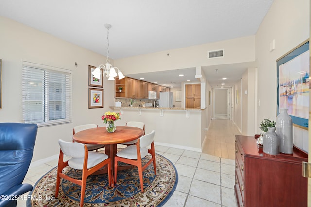 dining space featuring visible vents, baseboards, recessed lighting, an inviting chandelier, and light tile patterned flooring